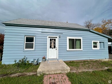 View of front of house with roof with shingles