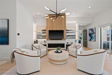Living room featuring a large fireplace, an inviti