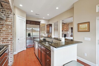 Kitchen with Granite Counters, Built In Refrigerat