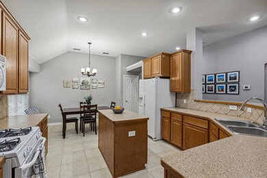 The kitchen opens to the family room and is great for enteratining
