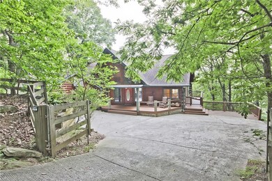 Driveway down to house.  Note the gate, which includes fenced in area for pets.