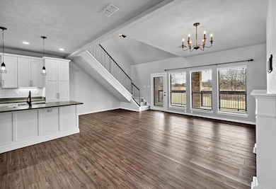 Open living/kitchen area with view to golf course.