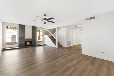 Unfurnished living room with baseboards, visible v