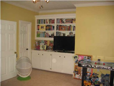 Upstairs bedroom with built-ins.