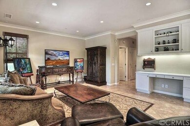 Adorned with crown molding and walls of windows, t