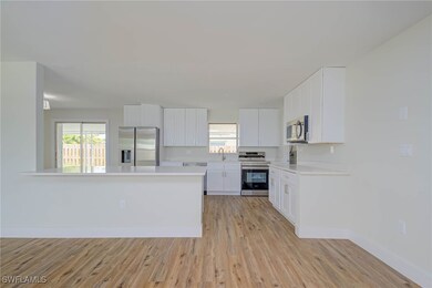 Kitchen with appliances with stainless steel finis