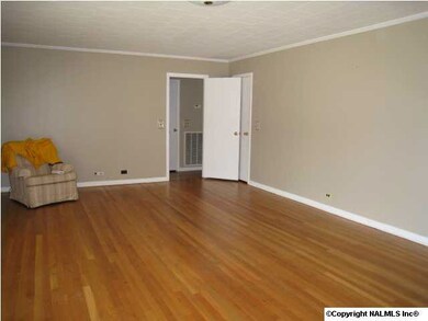 Oversized living area with pretty hardwood floors.