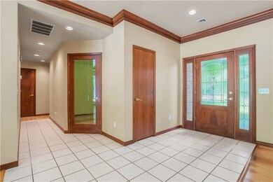 Entry with view of the office area and down the ha