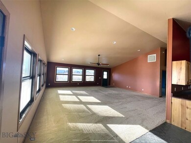 Vaulted ceilings with expansive dining, kitchen an