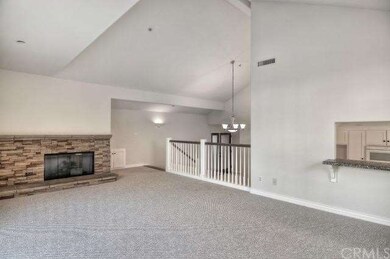 Relax by the fireplace in this spacious upstairs u