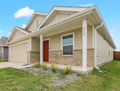 View of front facade featuring a front yard, an at