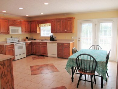 What a great space! Plenty of room to work & eat-even a patio door to the deck & private backyard.