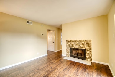 Unfurnished living room with dark hardwood / wood-