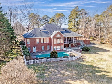 View of Pool and Back of Home
