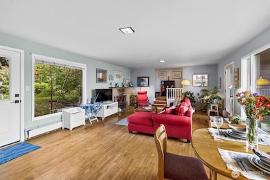 Spacious living room with abundant natural light and a cozy, inviting layout. Ideal for relaxing or gatherings.