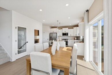 (Photos of model home, finishes will vary) The dining room is situated among the open floorplan, making it easy to move between the kitchen and Great Room.