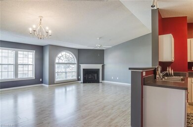 Kitchen overlooks dining and living area for easy mingling with company.