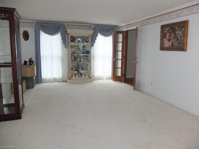 Formal living room with crown molding.