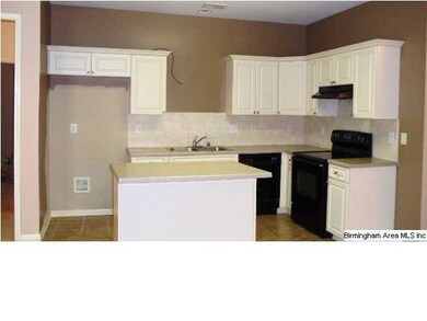 Lots of cabinets with tile backsplash