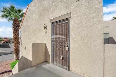 View of exterior entry with stucco siding