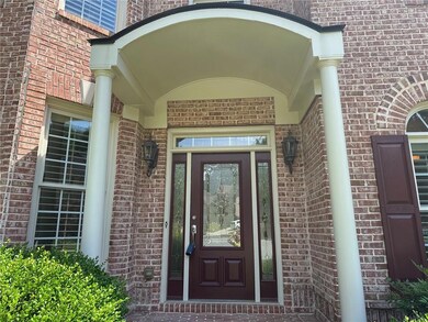Doorway to property with brick siding