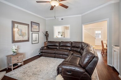 Living room opening to kitchen and dining rooms. O