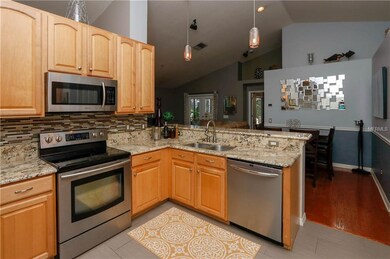 Kitchen looking into Breakfast Room and Family Roo