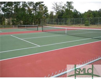 Exterior Front. TENNIS COURTS TO LEFT OF CLUBHOUSE
