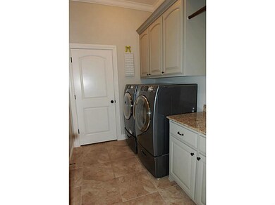 Laundry/Util Room. Generous laundry/utility area that boasts a closet, folding area and rod for hanging items.