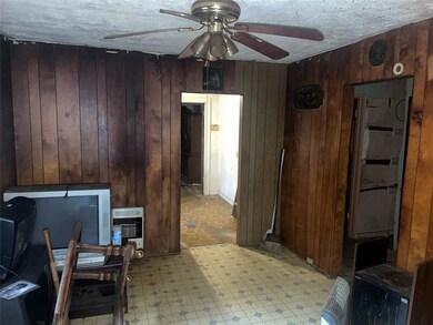 Office area with ceiling fan, light tile floors, a
