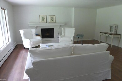 Inviting white on white front living room featurin