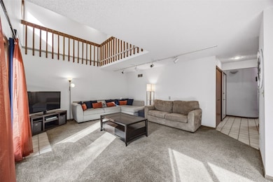 Living room with view of loft area on 2nd level