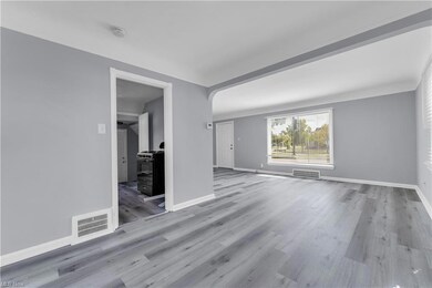View of hardwood floored spare room