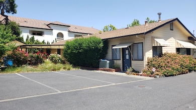 Rear entrance of 1241 Grove. A/C unit near rear entrance.