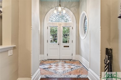 Welcoming open foyer with marble entry

