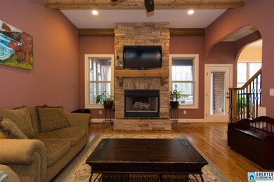 Curl up and relax next to your wood burning, floor to ceiling rock fireplace.