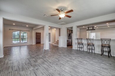 Living area with wood finished floors, a ceiling 
