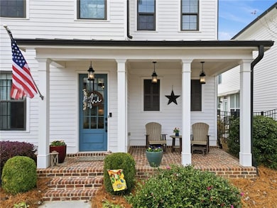 View of exterior entry with a porch