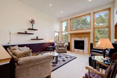 Wall of decorative windows around the gas fireplace with ceramic tile surround & wood mantle! NEW Marvin windows & doors (except front door).