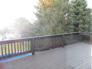 SLIDING DOOR FROM KITCHEN LEADS TO BEAUTIFUL DECK-