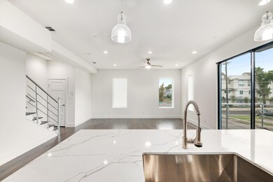 Kitchen with dark hardwood / wood-style floors, li