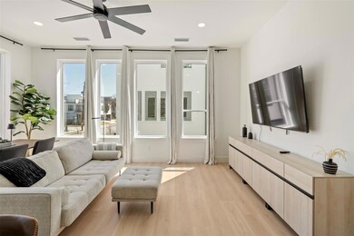Living room with recessed lighting, visible vents,