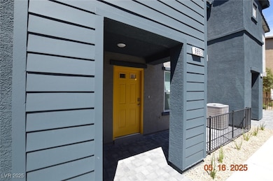 Property entrance featuring cooling unit