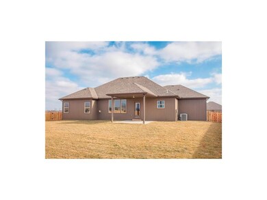 Back of the ranch style home.  Cover patio located