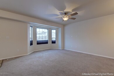 Bay window & ceiling fan in living area