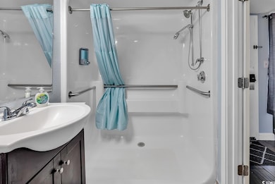 Bathroom featuring shower / bath combo, tile patte