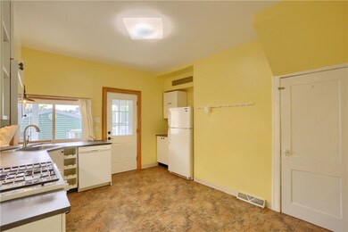 Large kitchen with space for breakfast table, pot