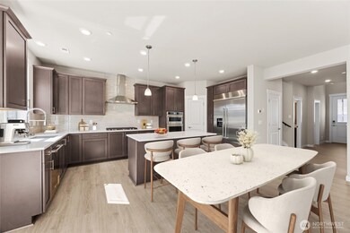 The Marigold has an excellent flow, with a wide 2 story entry - home for sale will include white cabinetry, this home is virtually staged.  Home includes gas cooktop & 30