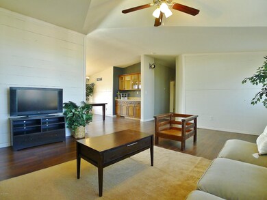 Living Room with Hall to Bedrooms & Den