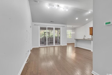 Unfurnished living room with wood-type flooring, s